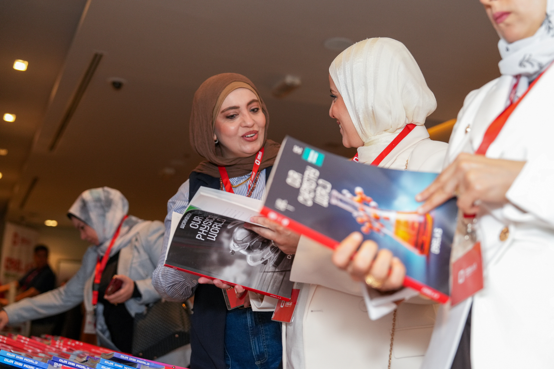 "Attendees exploring OBELAS programs and materials"