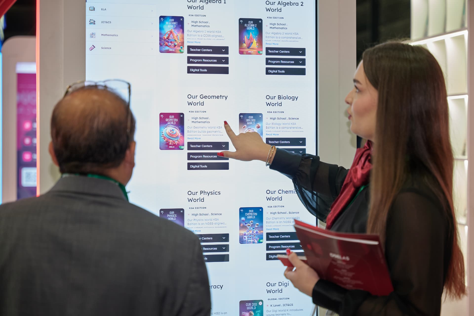 Visitors exploring the OBELAS program library on the interactive wall